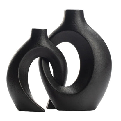 Black abstract vase on a white background