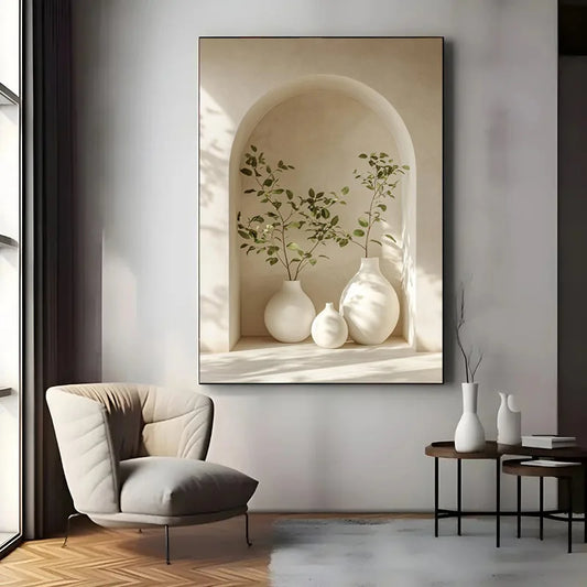Decorative wall art of white vases and green plants in a neutral-toned frame, displayed in a modern living room.