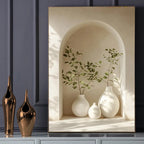 Decorative scene with white vases and a plant against a neutral wall.
