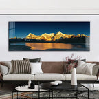 Panoramic mountain landscape painting above a living room sofa with decorative pillows.