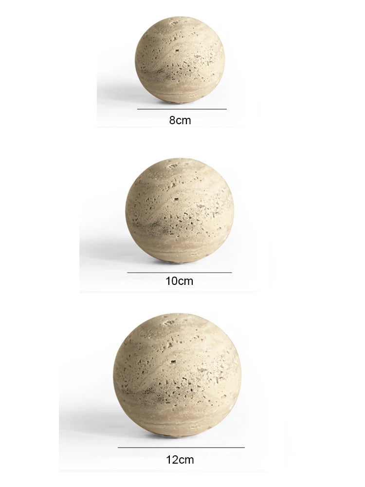 Three spherical objects of different sizes on a white background