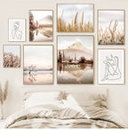 Wall art prints of nature scenes and line drawings in a bedroom setting.