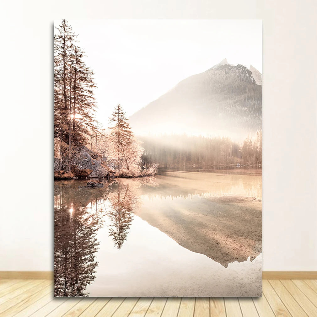 Large wall art of a mountain and lake scene with trees on a white wall.