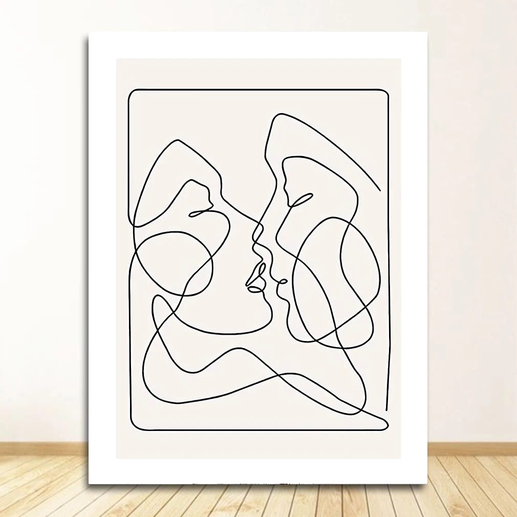 Abstract line art of two faces on a white wall.