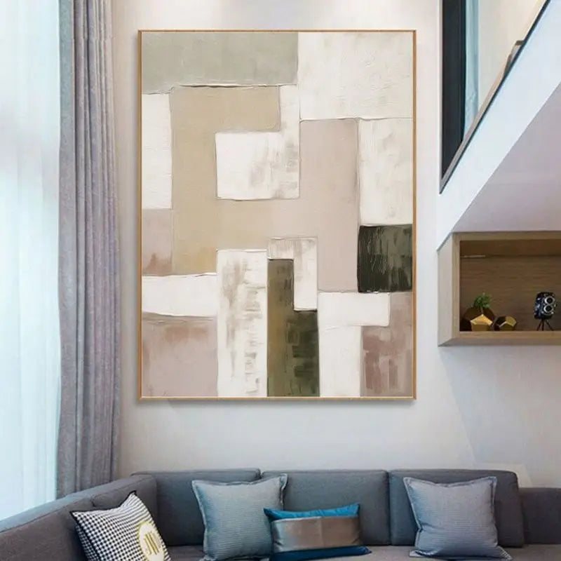 Abstract art piece on a wall above a sofa in a modern living room.