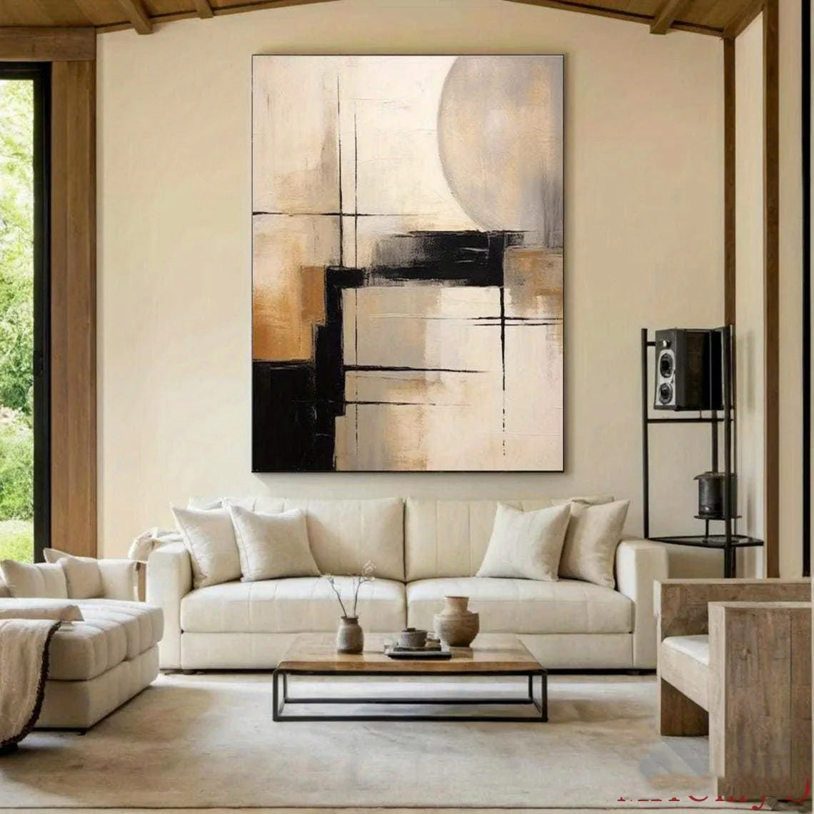 Modern living room with a beige sofa, abstract painting, and decorative items.