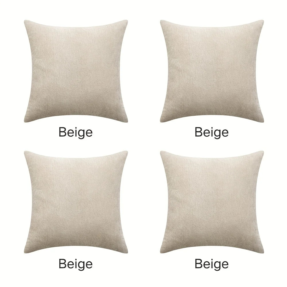 Four beige pillows of different sizes on a white background