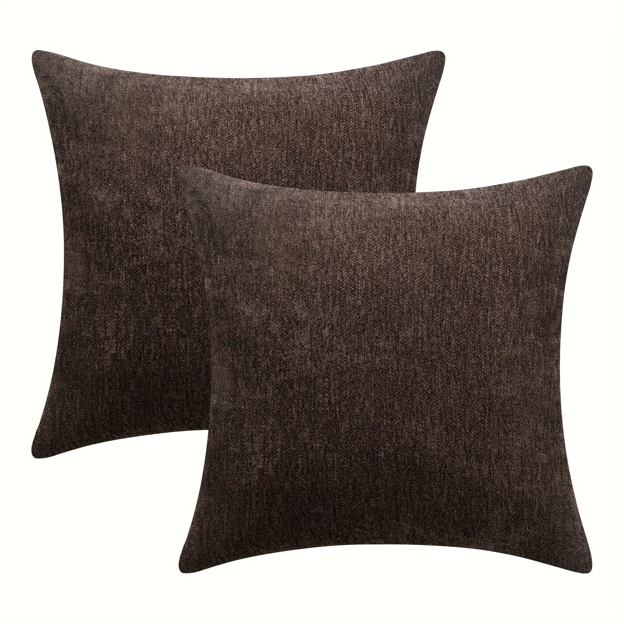 Two brown textured throw pillows on a white background