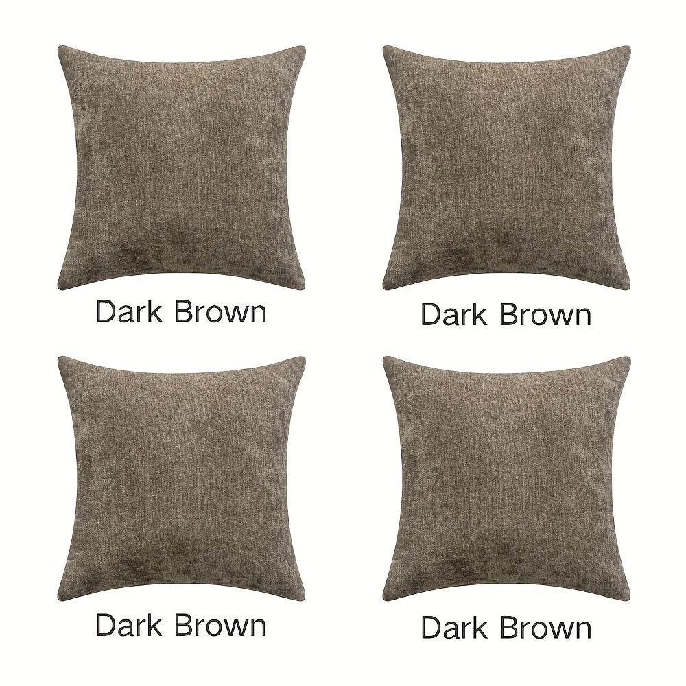 Four dark brown square cushions on a white background