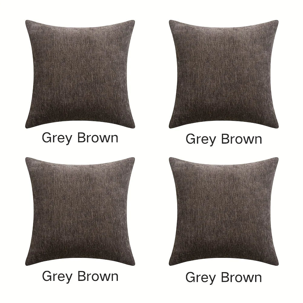 Four gray brown square cushions on a white background