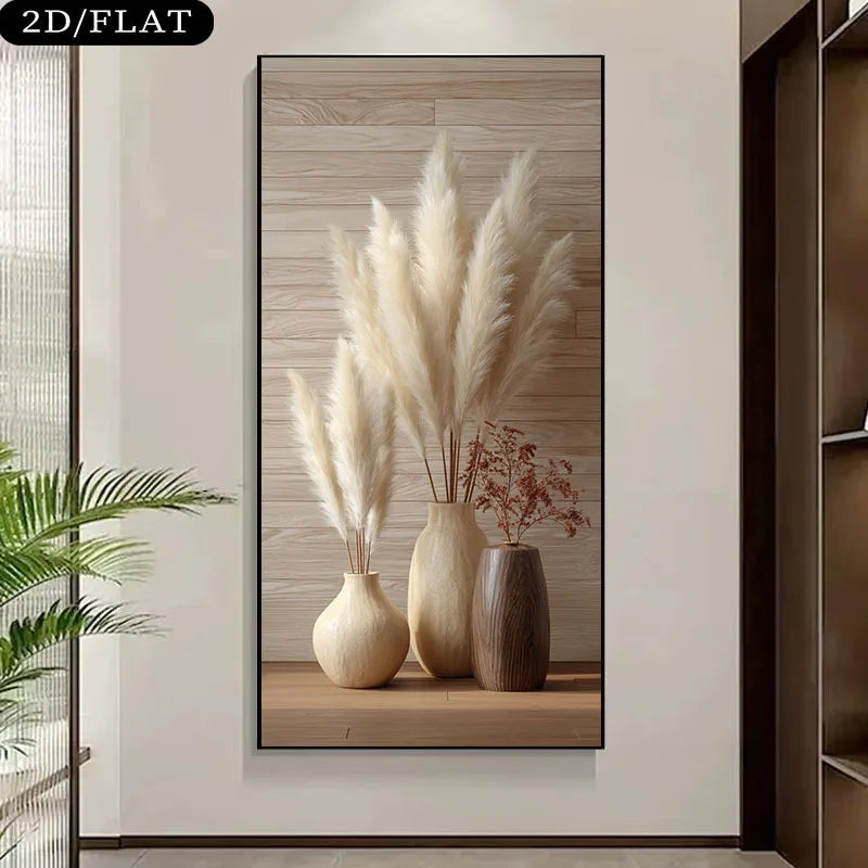 A wall art print showing three beige and brown vases with pampas grass and dried stems, displayed on a light wall in an interior setting.