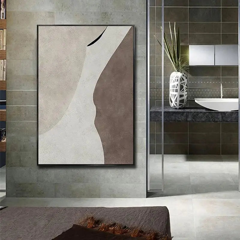 Abstract art piece on a wall in a modern bathroom setting