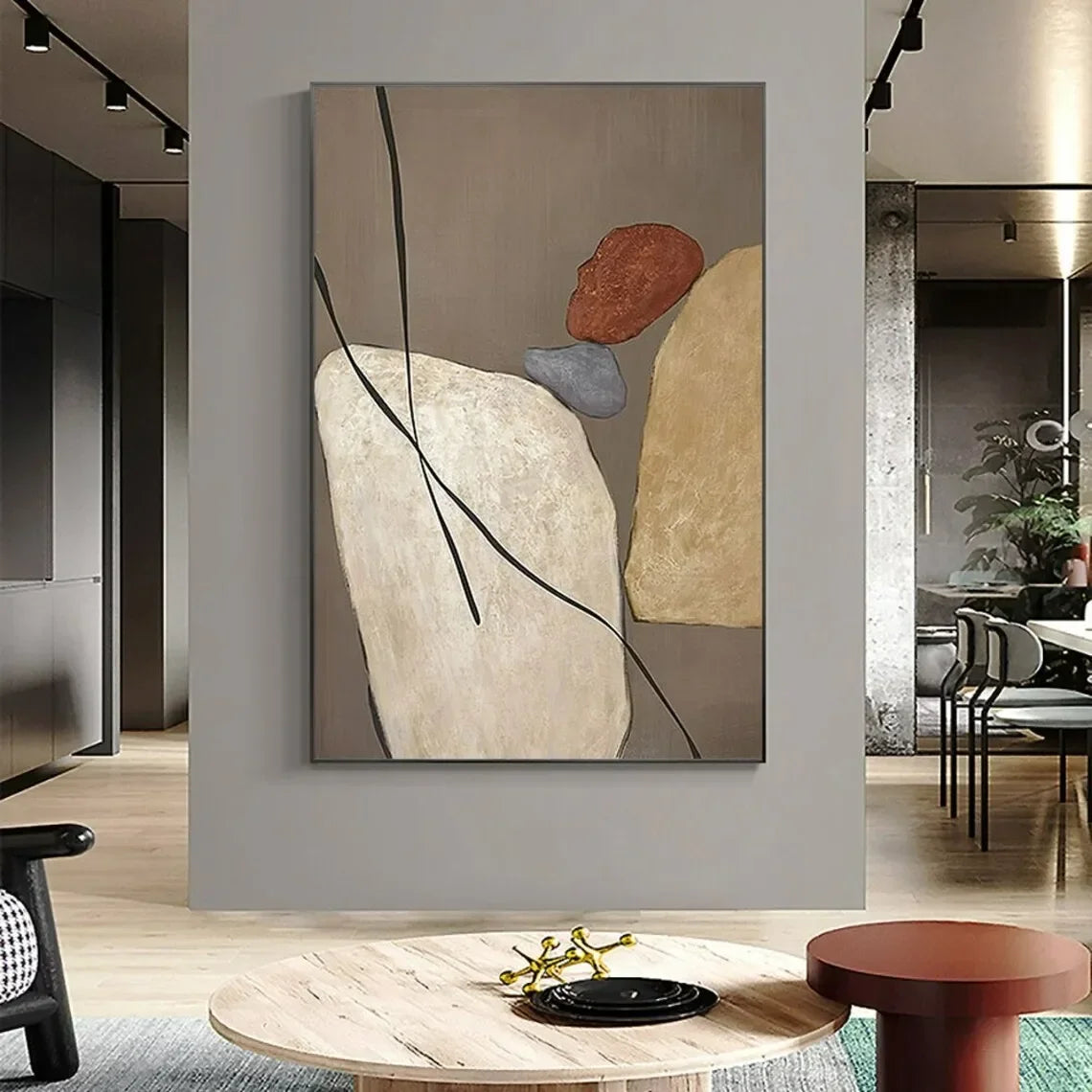 Abstract art piece on a wall in a modern living room