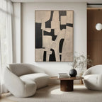 Modern living room with abstract art, white chairs, and a wooden coffee table.