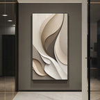 Abstract wall art piece on a gray wall in a modern interior setting.