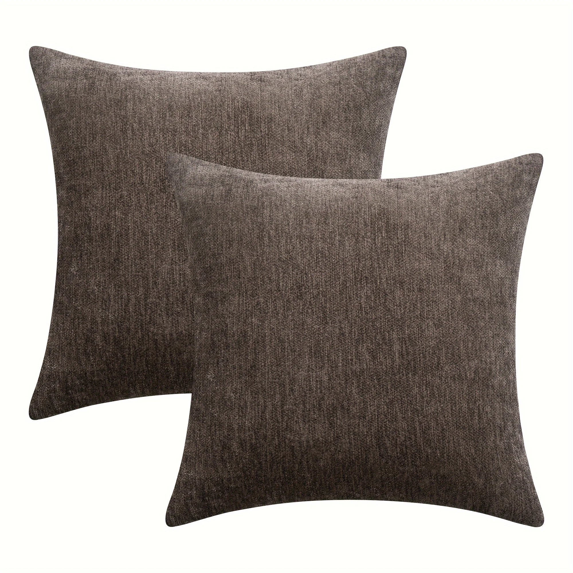 Two brown textured throw pillows on a white background