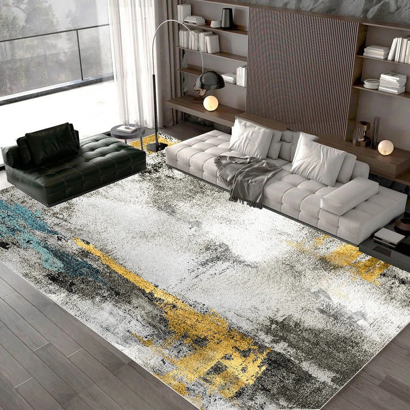 Modern living room with a large abstract area rug featuring gold and black patterns.