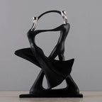 Black abstract sculpture on a gray background
