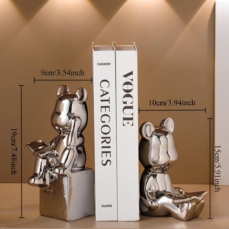 Silver bear bookends next to a white book titled 'Vogue Categories' on a beige background with measurements.