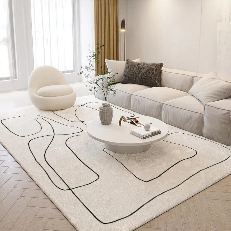 Modern living room with a sectional sofa, coffee table, and decorative rug.