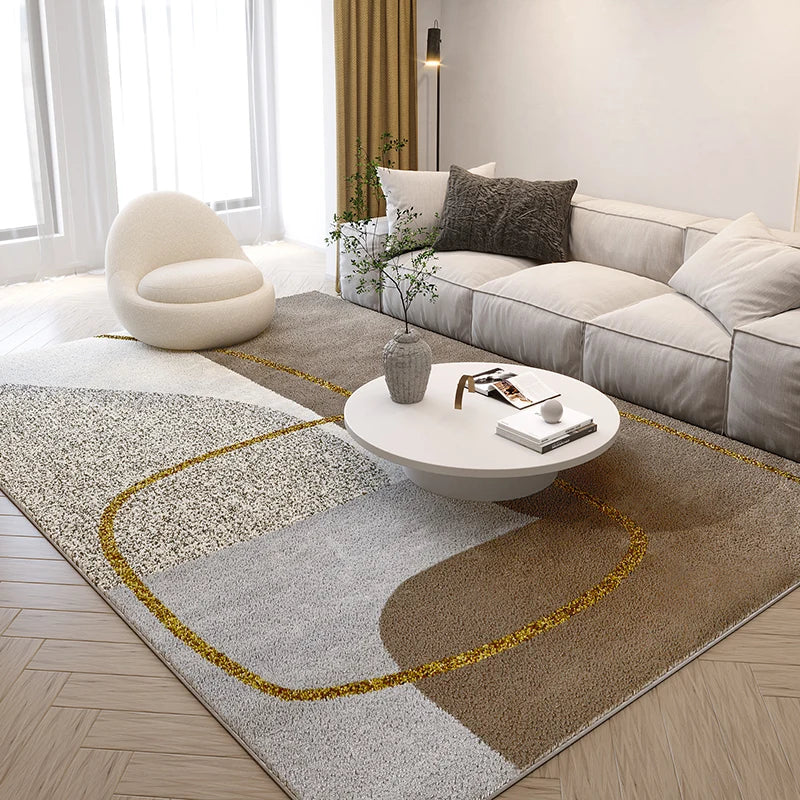 Modern living room with a patterned rug, sofa, and coffee table.