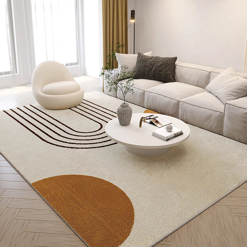 Modern living room with a patterned rug, sofa, and coffee table.