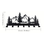 Metal wall art with mountain and tree design, shown with dimensions on a white background.