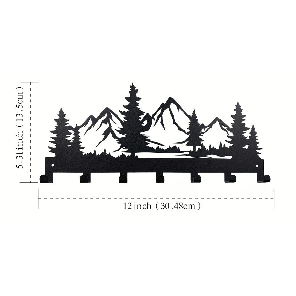 Metal wall art with mountain and tree design, shown with dimensions on a white background.