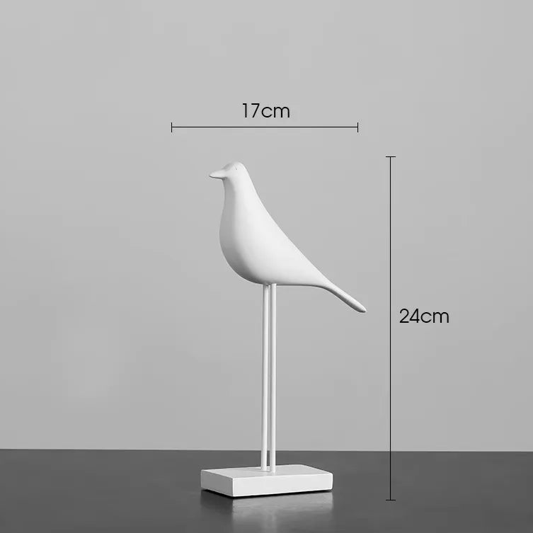White bird-shaped decorative object with dimensions on a gray background