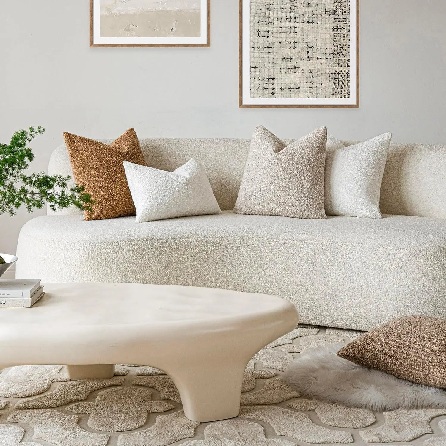 Beige sofa with decorative pillows in a living room setting
