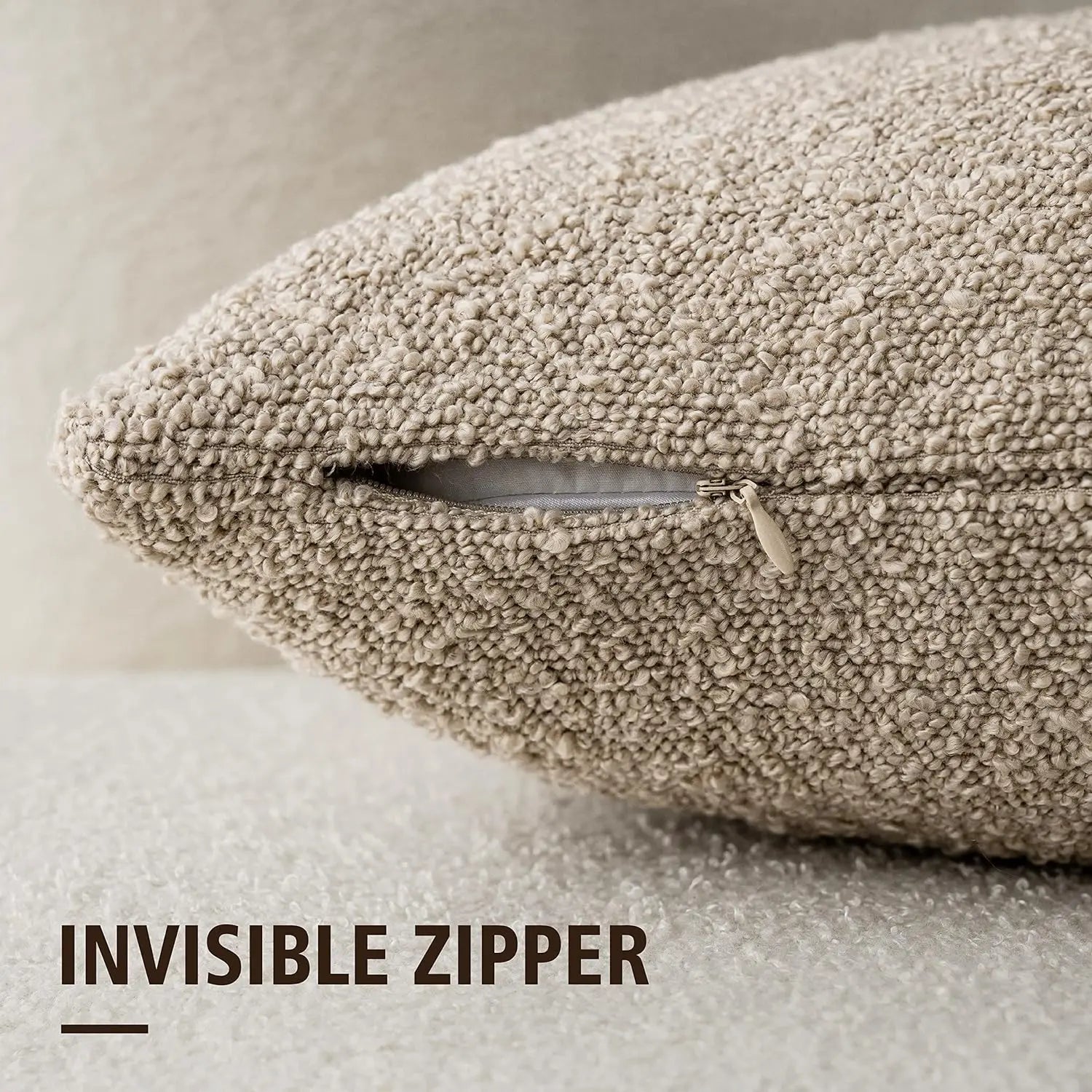 Beige textured pillow with an invisible zipper on a neutral background