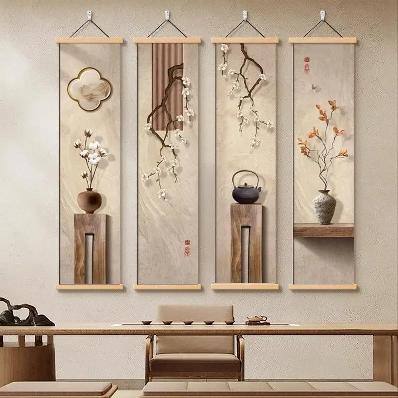 Four vertical wall art pieces with floral and teapot designs hanging above a wooden table.