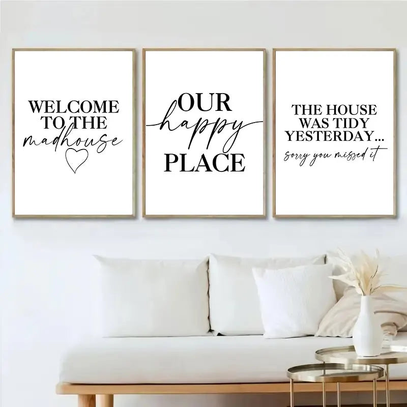 Three framed prints with humorous quotes on a wall above a sofa.