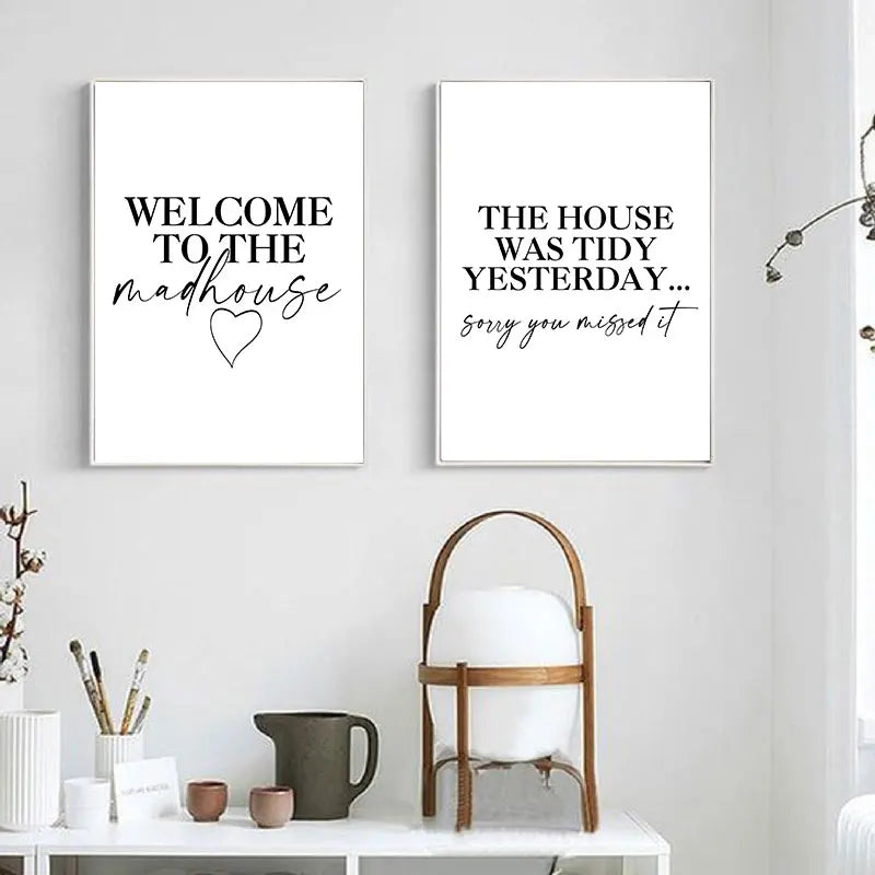 Two framed prints on a wall with decorative items below.