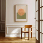 Modern interior with a framed abstract artwork on a wall and a wooden chair.