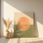 Abstract art print with a sun and birds on a beige wall, next to a vase with dried plants.