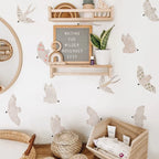 Nursery room with wooden shelf, decorative items, and baby products.