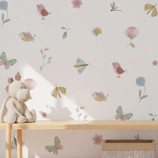 Children's room with wallpaper featuring birds, flowers, and butterflies, and a wooden shelf with a plush toy.