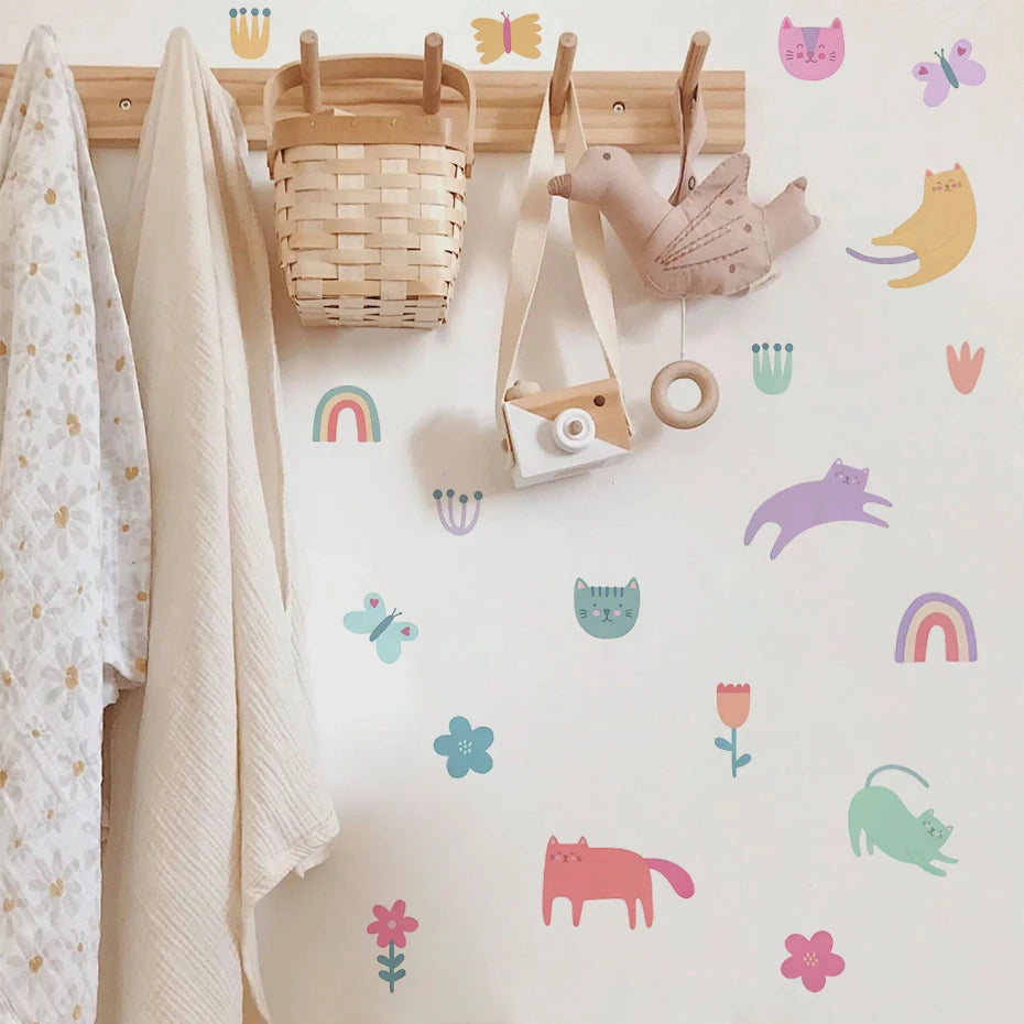 Children's room with hooks, basket, and toys against a wall with colorful animal and nature-themed decals.