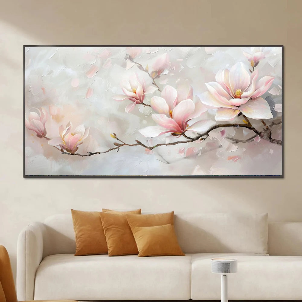 Floral painting on a wall above a sofa with decorative pillows.