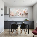 Modern kitchen with a dining table and chairs, featuring a large floral painting on the wall.