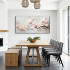 Dining area with wooden table, gray chairs, and a floral painting on the wall.