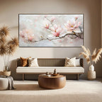 Modern living room with a floral painting on the wall above a sofa.