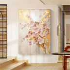 Abstract floral painting on a wall in a room with wooden floor and staircase.