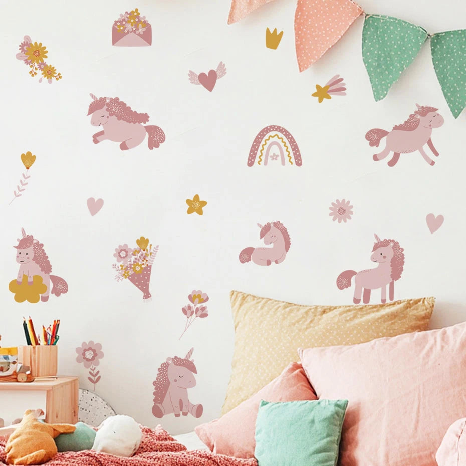 Children's room with pink unicorn wall decals, colorful pillows, and a bunting banner.