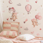 Children's room with teddy bear wall decals, balloons, and checkered pillow.