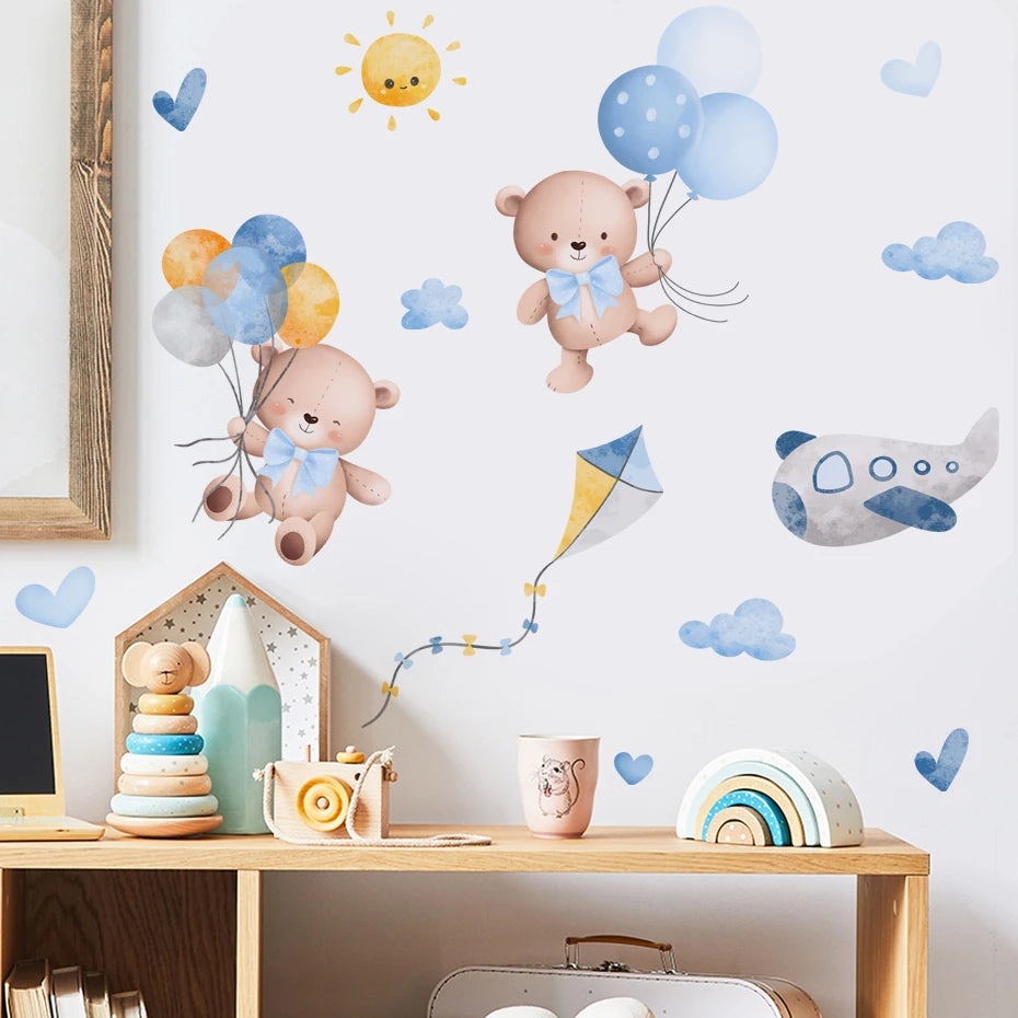Children's room with teddy bear wall decals, balloons, and toys on a white wall.