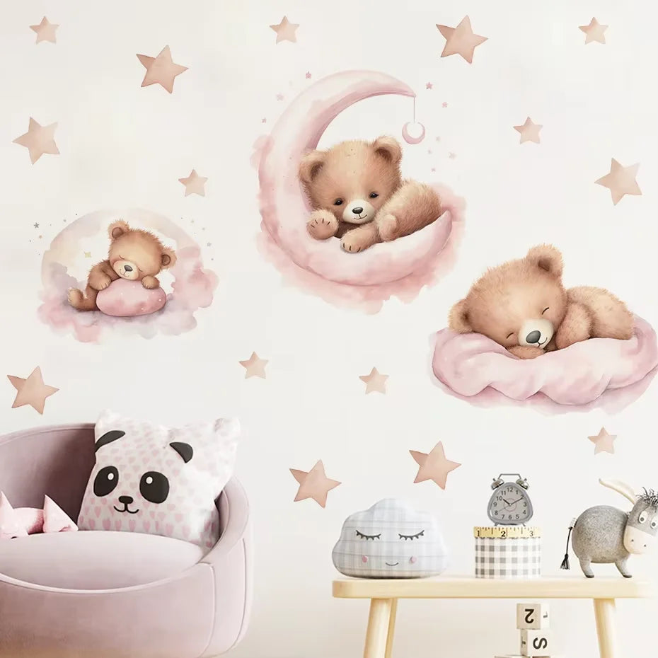 Children's room decor with teddy bears, stars, and a moon on a light pink wall.