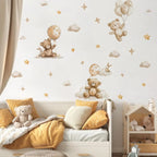 Children's room with teddy bear and balloon wall decals on a white wall.