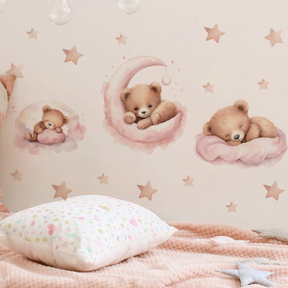 Children's room with teddy bear wall decals and a pink blanket.